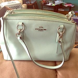 Coach purse light mint color.